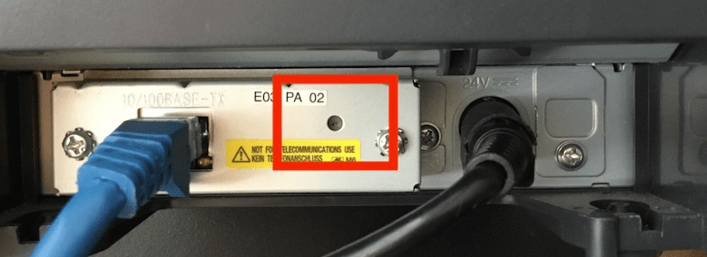The reset button on the back of the printer
